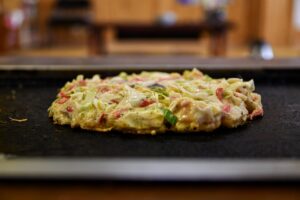Read more about the article Exploring the Delights of Okonomiyaki: A Traditional Japanese Dish